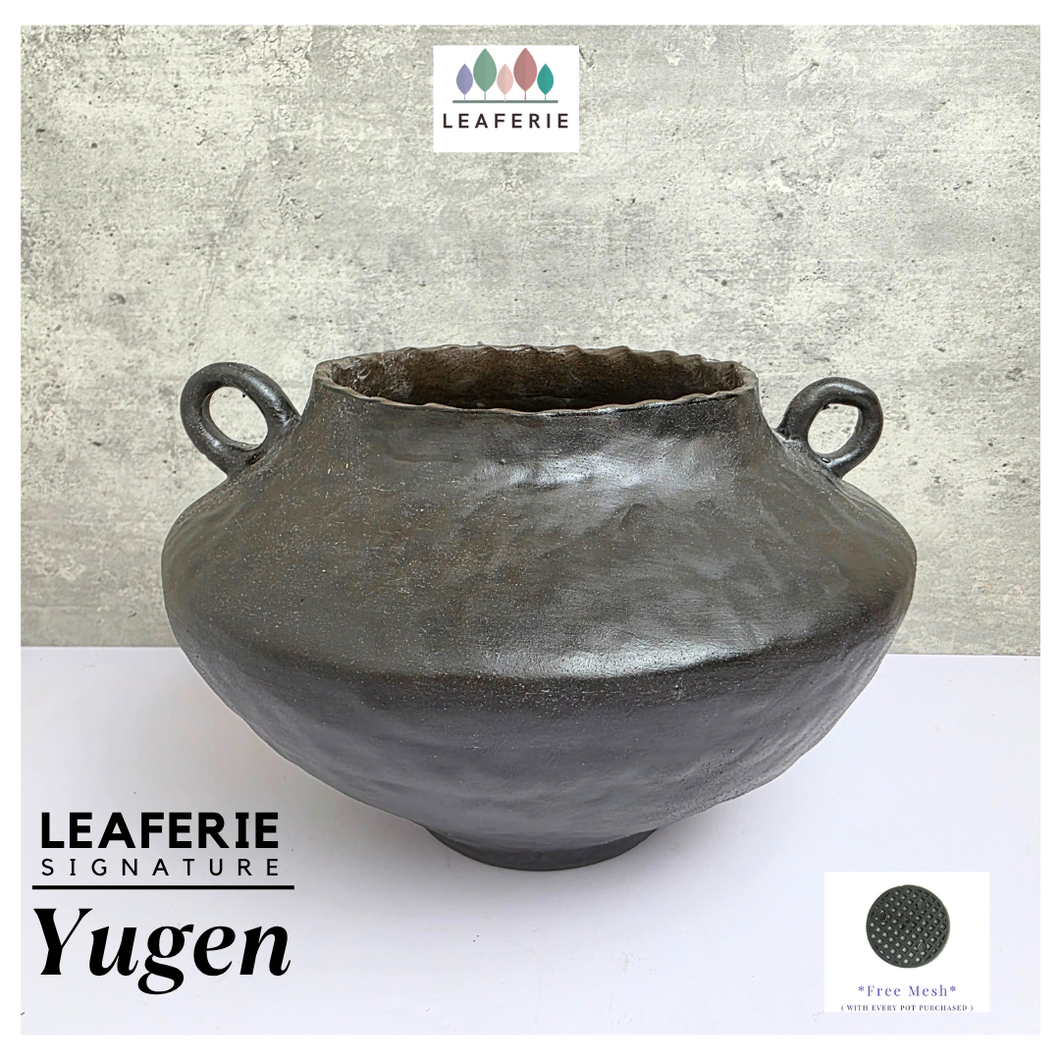 Leaferie SIgnature Black ceramic Flowerpot with handles on a white surface, branded 'Leaferie'.