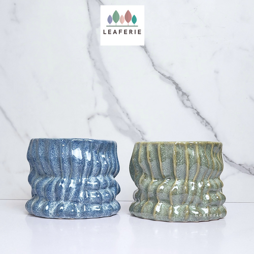 The Leaferie Zian Plant pot. blue and green colour planter. front view