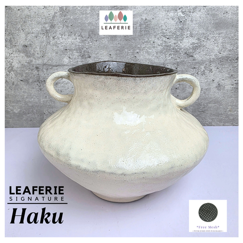 Haku Leaferie Signature White ceramic pot with handles .