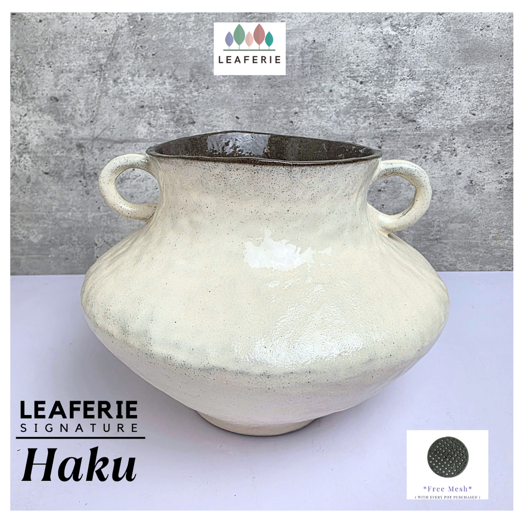 Haku Leaferie Signature White ceramic pot with handles .