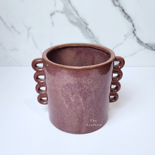 Load image into Gallery viewer, The Leaferie Juro red planter with many handles. ceramic material front view of pot
