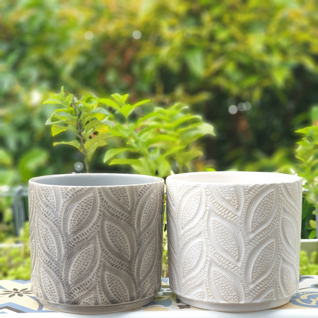 The Leaferie Elmeri plant pot. leaf imprint ceramic pot with 2 colours grey and white. front view