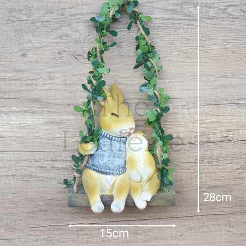 The Leaferie Lilly Belle Bunny. made from resin. rabbit on a swing. Front view and size