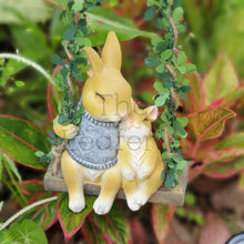 Load image into Gallery viewer, The Leaferie Lilly Belle Bunny. made from resin. rabbit on a swing. Front view 
