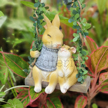 Load image into Gallery viewer, The Leaferie Lilly Belle Bunny. made from resin. rabbit on a swing. Front view 
