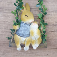 Load image into Gallery viewer, The Leaferie Lilly Belle Bunny. made from resin. rabbit on a swing. Front view 
