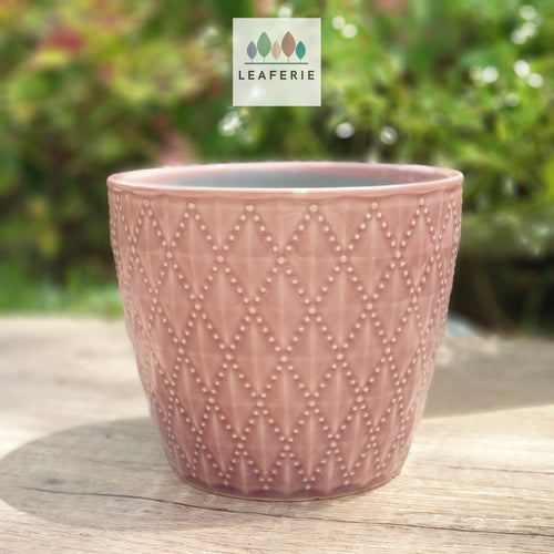 The Leaferie Thelon red flowerpot. ceramic material