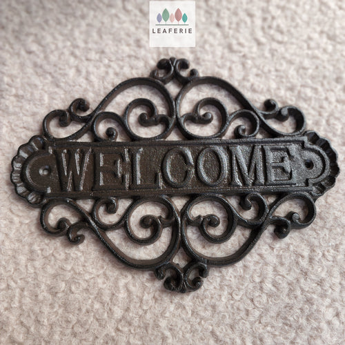 The Leaferie Cast Iron HOME welcome sign. front view