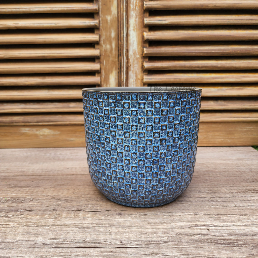 The Leaferie Chambery pot. blue and green ceramic plant pot . front view of blue pot