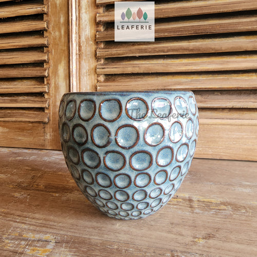 The Leaferie Eisen blueish ceramic pot. front view