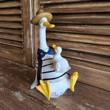 Load image into Gallery viewer, The Leaferie Donnie Duck Garden decoration. made from Resin. duck with duckling side view
