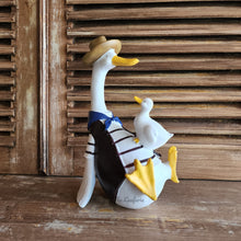Load image into Gallery viewer, The Leaferie Donnie Duck Garden decoration. made from Resin. duck with duckling side view
