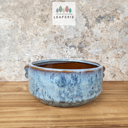 The Leaferie Bentham plant pot. shallow blue ceramic pot. front view