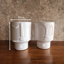 Load image into Gallery viewer, The Leaferie Axel plant pot . front view. white ceramic face plant pot. measurement
