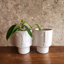 Load image into Gallery viewer, The Leaferie Axel plant pot . front view. white ceramic face plant pot. with plant
