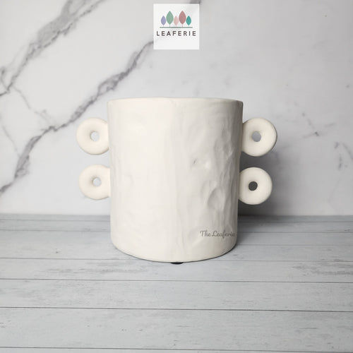 The Leaferie Enora white planter. planter with 4 handles. front view