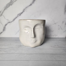 Load image into Gallery viewer, The Leaferie Faustine face white ceramic pot. front view
