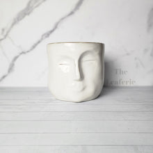 Load image into Gallery viewer, The Leaferie Faustine face white ceramic pot. front view
