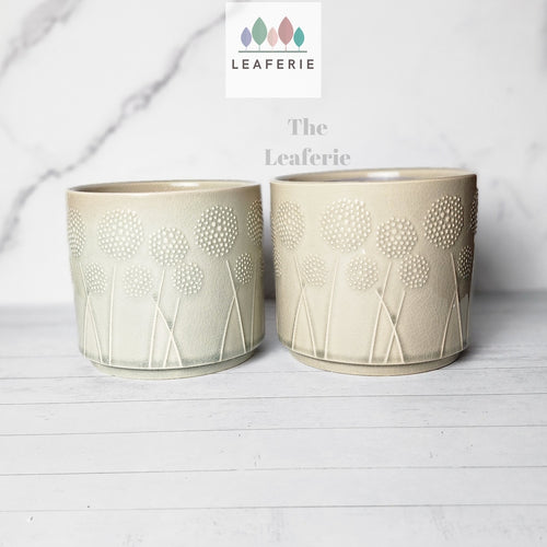 The Leaferie Dandelion Flowerpot ceramic plant pot with 2 designs. front view