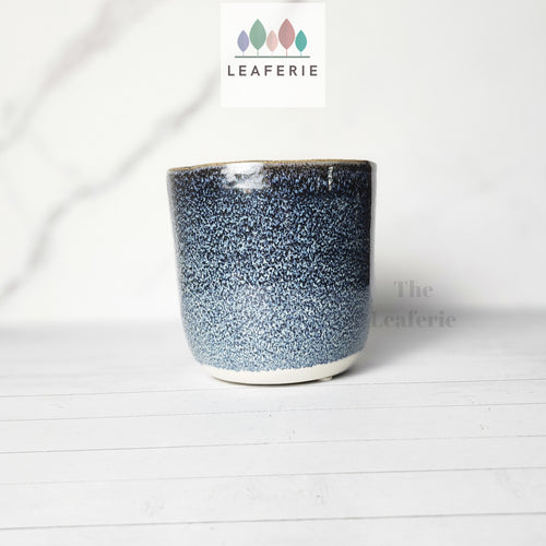 The Leaferie Elie planter  blue ceramic pot. front view