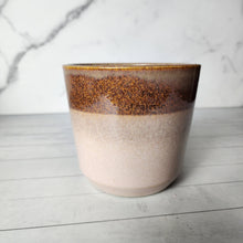 Load image into Gallery viewer, The Leaferie Timeo plant pot. brown on top and beige at the bottom.
