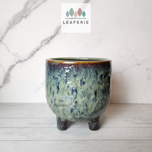 The Leaferie isaure blueish ceramic pot with legs