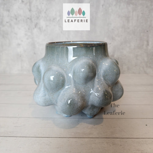 The Leaferie ciara plant pot. blue ceramic flowerpot. front view