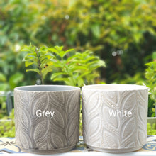Load image into Gallery viewer, The Leaferie Elmeri plant pot. leaf imprint ceramic pot with 2 colours grey and white. front view of grey and white planter
